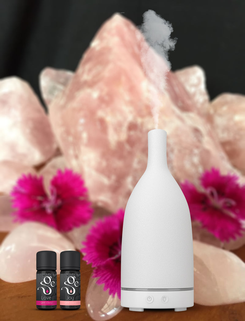 white stone diffuser and Love and Joy aromatherapy diffuser blends with essential oils and gemstones