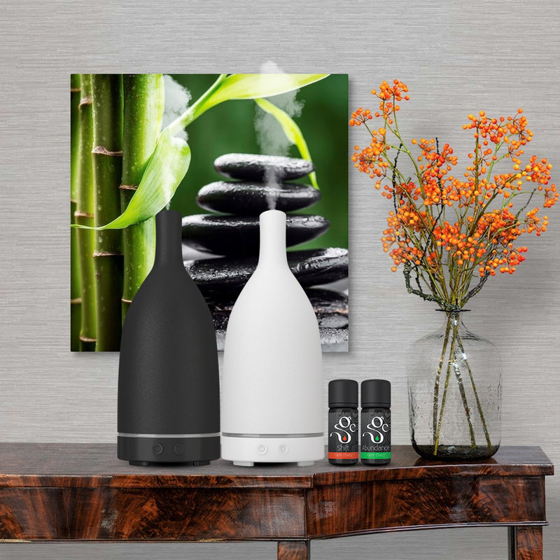 black and white stone diffusers and Shift and Abundance aromatherapy diffuser blends with essential oils and gemstones
