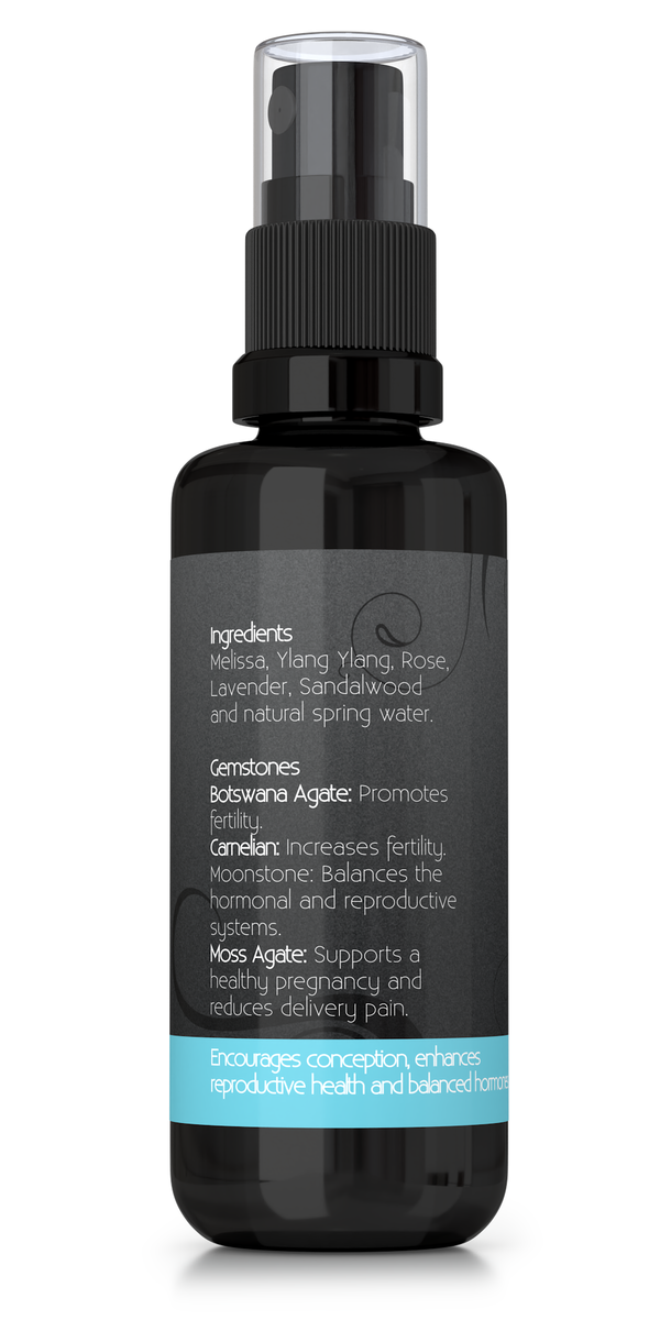 Fertility aromatherapy spray with essential oils and gemstones, backside of bottle showing ingredients